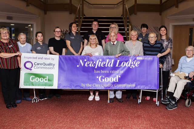 Residents and staff of Newfield Lodge Castleford celebrating their good rating from the Care Quality Commission watchdog