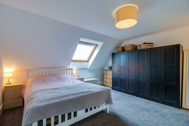 The principal bedroom features fitted wardrobe and an en suite.