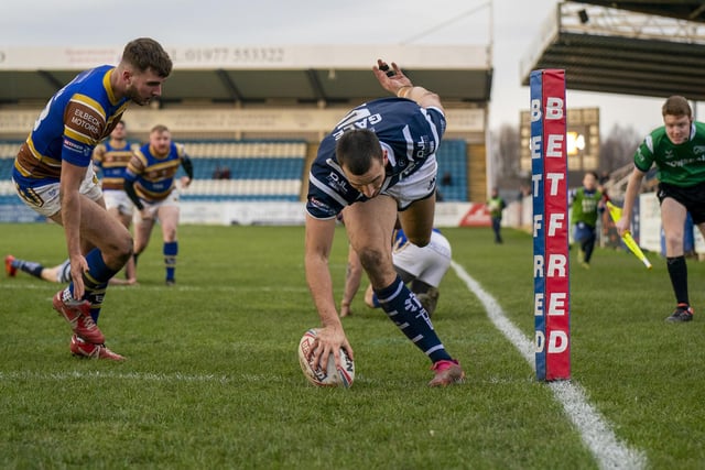 Gareth Gale touches the ball down in the corner for a try.