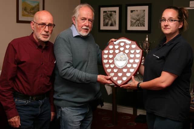 Team members from Division Two champions Kippax Legionnaires Graham Sharp and Ian Sutton (captain), with Stacey Curtis, of Layers Cleaning.