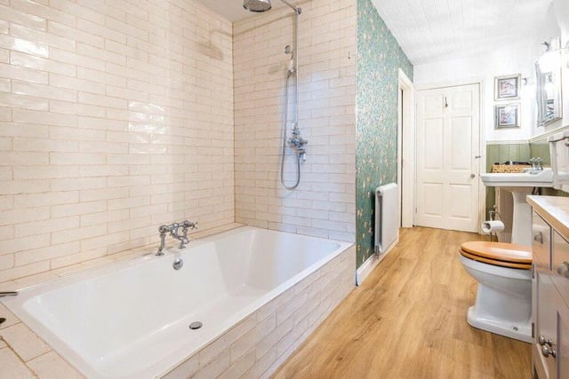 This spacious bathroom is one of two within the property.