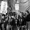 One of a series of photographs taken by the late Richard Clarkson during the 1984-1985 miners strike. Miners from Sharlston marching with the Sharlston NUM banner