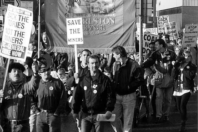 One of a series of photographs taken by the late Richard Clarkson during the 1984-1985 miners strike. Miners from Sharlston marching with the Sharlston NUM banner
