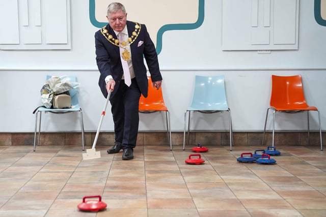 Mayor Coun David Jones tried his hand at indoor curling.