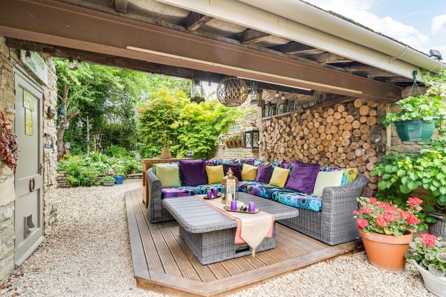 This covered seating area is ideal for enjoying meals or drinks outside, and for entertaining friends and family..