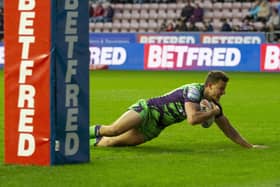Louis Senior dives over for a try on his debut at Wigan after joining Castleford Tigers on loan from Hull KR. Picture: John Victor