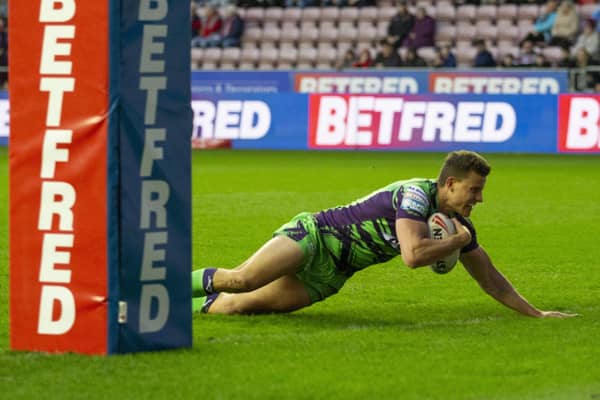 Louis Senior dives over for a try on his debut at Wigan after joining Castleford Tigers on loan from Hull KR. Picture: John Victor