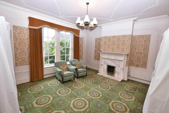 A 70s style carpet and feature fireplace in this spacious property.