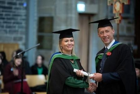 Graduate collecting their degree from by Heart of Yorkshire Education Group Governor, Martyn Shaw