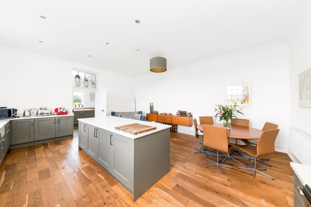 The spacious dining kitchen with adjoining utility area.
