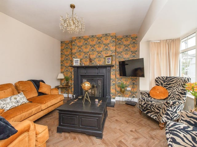 The grand fireplace with open fire is a focal point of this comfortable lounge.