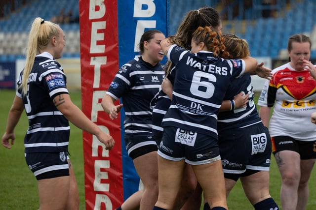 Delighted Featherstone Rovers Women players celebrate.