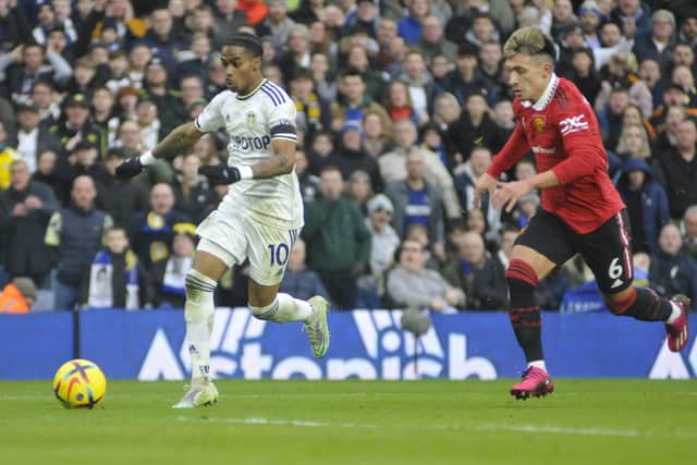 Leeds United winger Crysencio Summerville gets away from Manchester United's Lisandro Martinez.