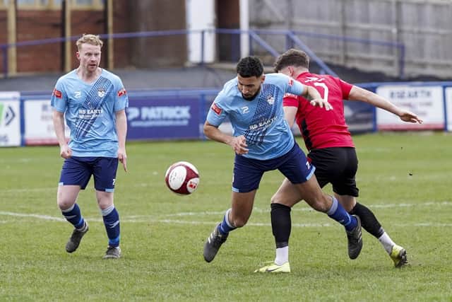 Ossett United's Nathan Curtis battles for the ball against Sheffield. Picture Scott Merrylees