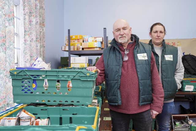 Coun Pete Girt and Amy Oakley from Knottingley Foodbank, which is appealing for donations after much of its stock was stolen in a break in.