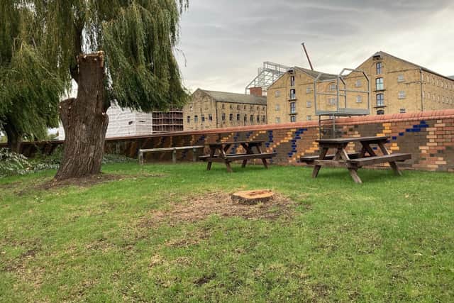 An investigation has been launched after a willow tree was chopped down outside a The Wharf pub, in Wakefield.