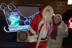 Sue Casey, secretary of Bridge Community Group, with Father Christmas at last year's Carols Round The Tree.