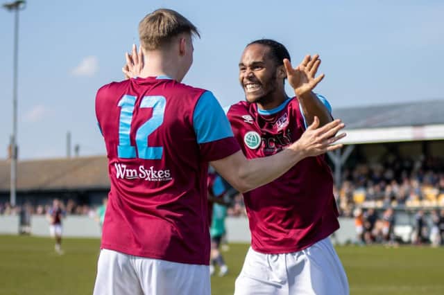 Jake Kelly celebrates scoring a goal against Barton Town with teammate Iyrwah Gooden. Picture: Mark Parsons