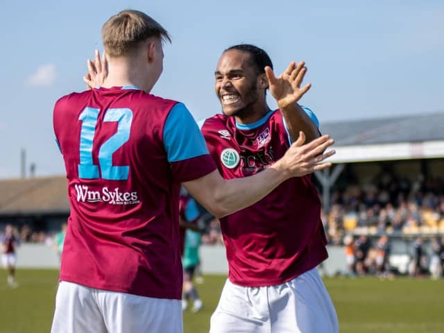Jake Kelly celebrates scoring a goal against Barton Town with teammate Iyrwah Gooden. Picture: Mark Parsons