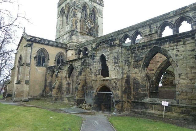 This entry refers only to the ruinous portion of the church as the main worship space is in good condition. This C14 and C15 century church was severely damaged under siege during the Civil War. The ruined aisled nave is in very poor condition with signs warning of the danger of falling masonry.