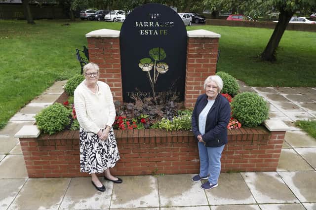 Carole Hardwick and Patricia Green with The Barracks Estate War Memorial which has been vandalised. Picture Scott Merrylees