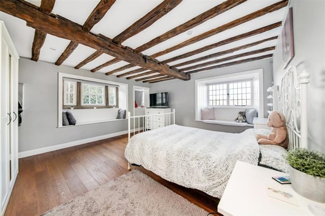 A beamed bedroom within the Grade ll listed property.