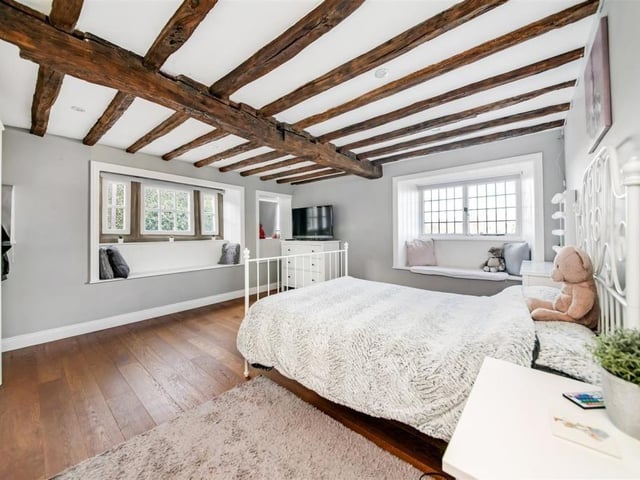 A beamed bedroom within the Grade ll listed property.