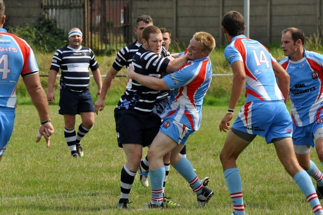 Featherstone Lions' Scott Glassell is stopped by the Normanton Knights defence. But his side were celebrating at the end after winning 24-22 in a close National Conference Division Two game.