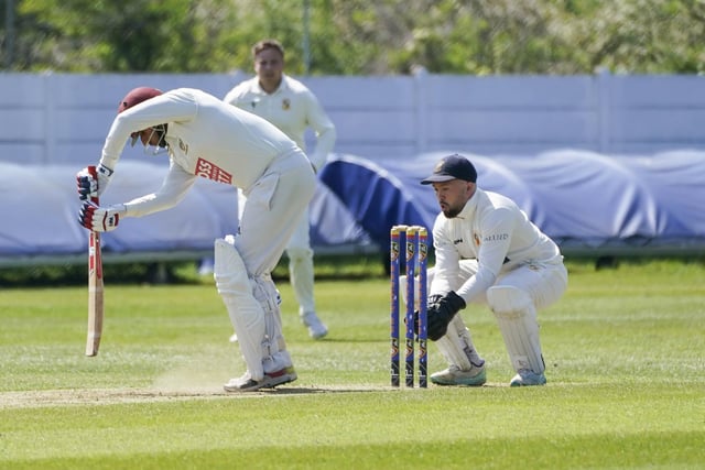 Townville wicketkeeper Liam Booth keep a close eye on how this Ossett player plays against spin.