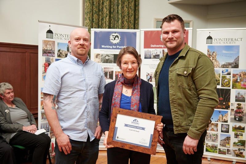 Mill Hill Road builders won the Residential Award. Pictured: David Midgley, Evelyn Westwood (PCS) and Ben Hitch. 

The judges said: "This is another transformative project.

"Entering the hallway, is an immediate “Wow”, and that’s probably why the property has now been sold. Stained glass has been retained, the original fire has been moved from the rear kitchen to the front lounge, which gives more space for it to be used.

"The all-new kitchen has quartz work surfaces to the left, the fireplace opening has been retained, and plenty of light comes from above, and from the rear bi-fold doors.

"The staircase has hard-crafted, stained and painted balustrade, and a toilet and store has been added under the stairs.

"The bathroom has a roll top bath, twin sinks and a walk-in shower. The bedrooms are substantial, complimented by traditional radiators.

"Outside is a low maintenance rear garden, which allows for entertaining space, finished with high quality flag stones."