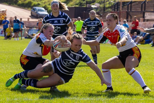Hannah Watts about to go over for a try for Featherstone Rovers Women at Bradford. Photo by John Victor