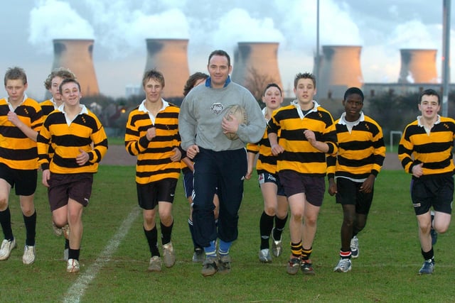 School liaison officer PC Martyn Norton helping coach Airedale High School's under-15s rugby league team.