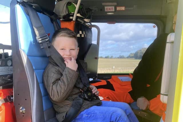 Fraser's nephew enjoyed sitting in the air ambulance helicopter.