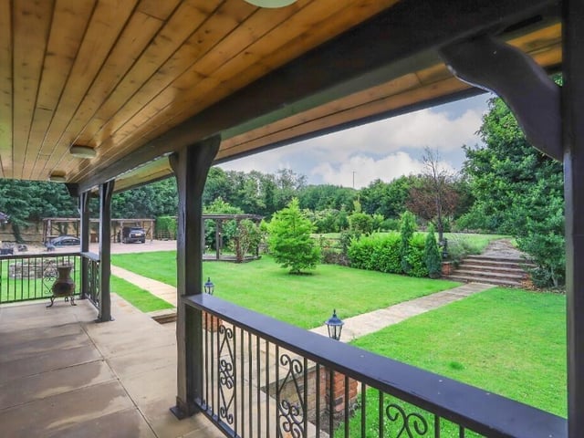 Tiered and landscaped gardens have mature trees and shrubs.