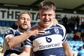 Connor Wynne celebrates his match winning try with Featherstone Rovers teammate Connor Jones. Picture: Kevin Creighton
