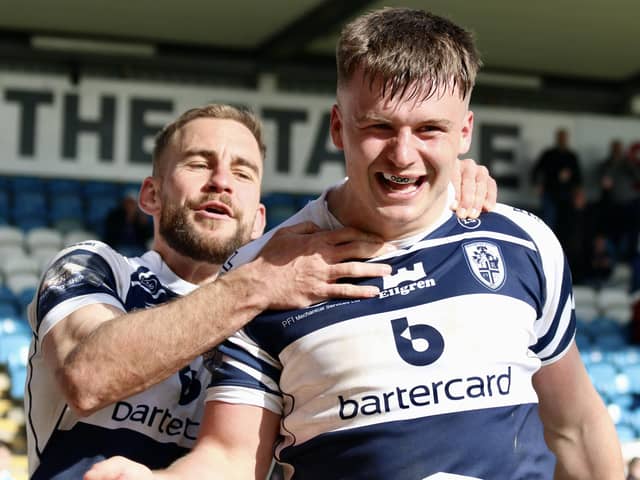 Connor Wynne celebrates his match winning try with Featherstone Rovers teammate Connor Jones. Picture: Kevin Creighton