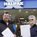 Hazel Rowley and Alan Wright with their petition to save the Halifax bank in Nornmanton from closure.