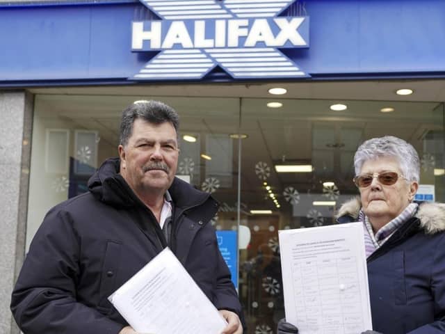 Hazel Rowley and Alan Wright with their petition to save the Halifax bank in Nornmanton from closure.