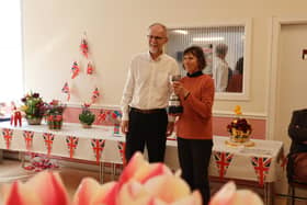 Professor Jonathan Seville presents a trophy to one of the winners, Judy Baker. The Wakefield & North of England Tulip Society Show was held at Ossett War Memorial Community Centre.