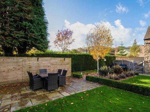 One of the outdoor patio seating areas within the garden.