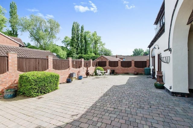 A block paved driveway leads to a fully enclosed courtyard with wall and fenced boundaries - ideal for entertaining.