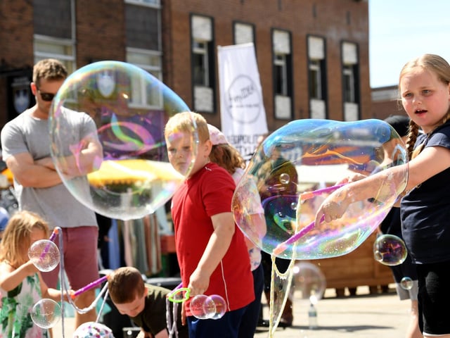 Children played with bubbles at the festival in 2022.