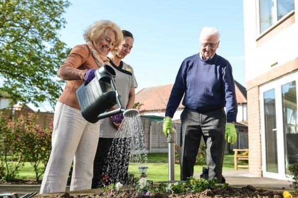 Residents and staff of Newfield Lodge pictured taking part in outside activities during the 10 years the Castleford care home has been active in the community