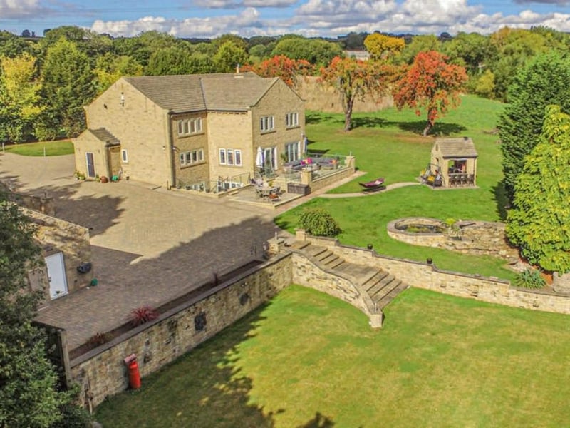 On the market for £1,950,000 with Yorkshire's Finest, this property is described as: "Sitting majestically in its own land which extends to approx. 10 acres is Haigh Hall Springs Farm, a commanding residence built only 10 years ago with a high tech contemporary interior which extends in total to 7883 square feet including the garage block."