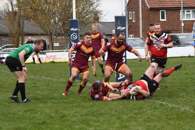 Stu Biscomb plunges over for a try.