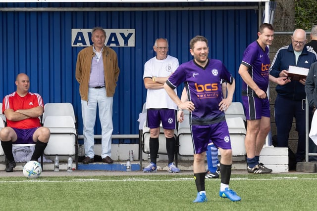 Comedian Jon Richardson watches on with ex-Leeds United defender David Wetherall taking instructions on the sidelines.