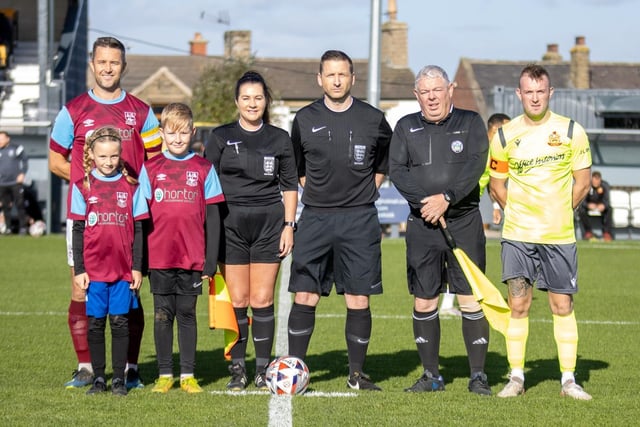 The team captains, match officials and mascots line-up before the start.