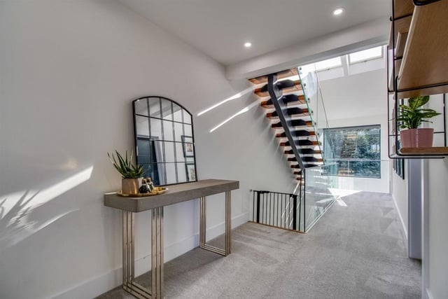 The first floor landing features a glass balustrade with a further floating staircase with solid oak steps with glass balustrade leading to the second floor.