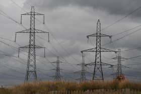 Electricity pylons transporting electricity for the National Grid. The National Grid has warned the UK of possibilities of blackouts over the coming months. Photo by Daniel LEAL /Getty Images)