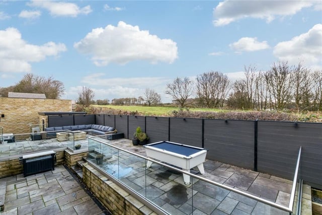 Externally to the rear elevation of the property stretches approximately 4 acres of lawned garden with various paved terraces, gravel areas for parking and a waterfall water feature outside the swimming pool area.